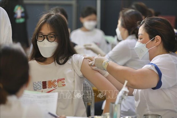 Hanoi exige uso eficaz de vacunas contra COVID-19 hinh anh 1