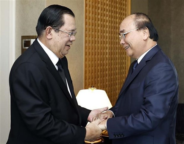 Presidente vietnamita se reune con lideres que asisten al funeral del difunto expremier japones hinh anh 1