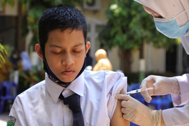 Laos despliega campana de vacunacion contra la COVID-19 en ninos hinh anh 1
