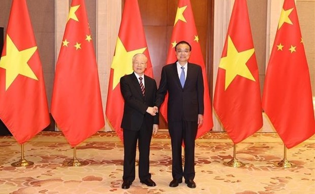 Maximo dirigente partidista de Vietnam se reune con premier de China hinh anh 1