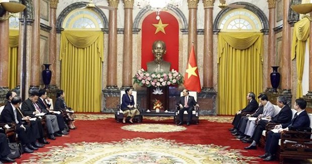 Presidente de Vietnam recibe a dirigente partidista de Laos hinh anh 2