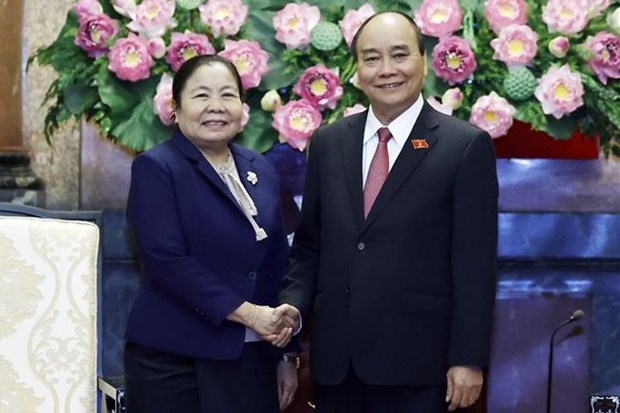 Presidente de Vietnam recibe a dirigente partidista de Laos hinh anh 1