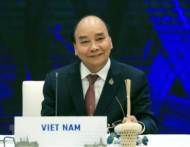 Presidente vietnamita asiste a dialogo informal entre lideres de APEC e invitados hinh anh 1