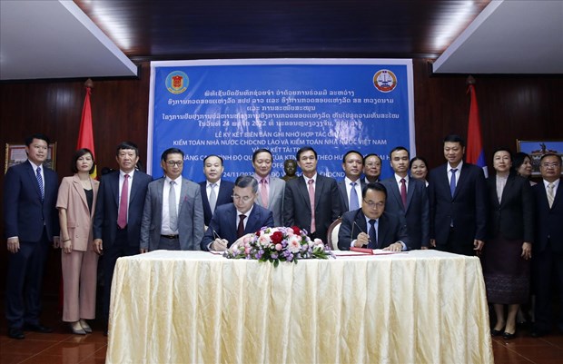 Vietnam y Laos cooperan en sector de auditoria hinh anh 1