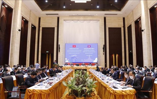 Efectuan noveno seminario teorico entre partidos politicos de Vietnam y Laos hinh anh 1