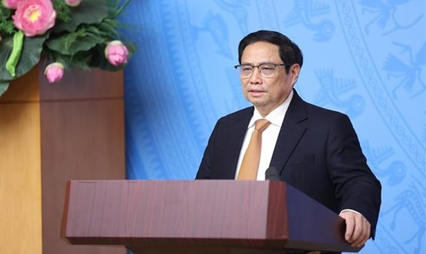 Primer ministro de Vietnam preside reunion sobre la respuesta contra COVID-19 hinh anh 1