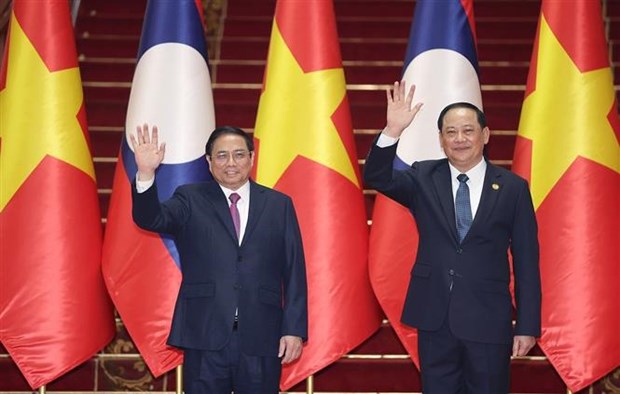 Destacan resultados integrales de visita oficial del premier vietnamita a Laos hinh anh 1
