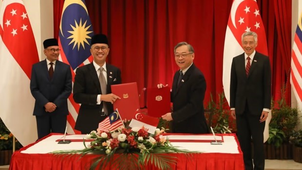 Singapur y Malasia firman acuerdos de cooperacion economica hinh anh 1