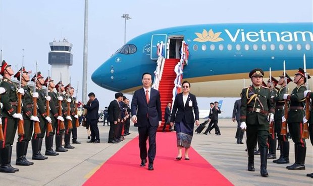 Presidente de Vietnam llega a Vientiane para iniciar su visita oficial a Laos hinh anh 2