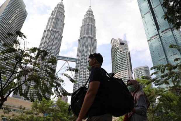 Fitch Solutions pronostica reduccion ligera en crecimiento crediticio de Malasia hinh anh 1