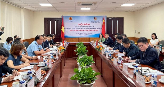 Vietnam y China intercambian experiencias de gestion del mercado hinh anh 1