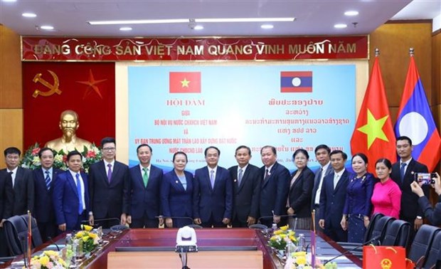 Vietnam y Laos comparten experiencias en gestion de asuntos religiosos hinh anh 2