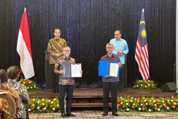 Indonesia y Malasia firman actualizacion de acuerdo comercial fronterizo hinh anh 1