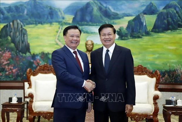 Presidente de Laos aprecia cooperacion entre Hanoi y Vientiane hinh anh 1