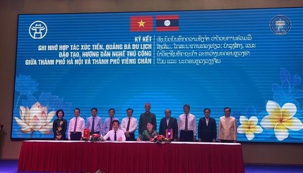 Buscan promover cooperacion economica entre Hanoi y localidades laosianas hinh anh 1